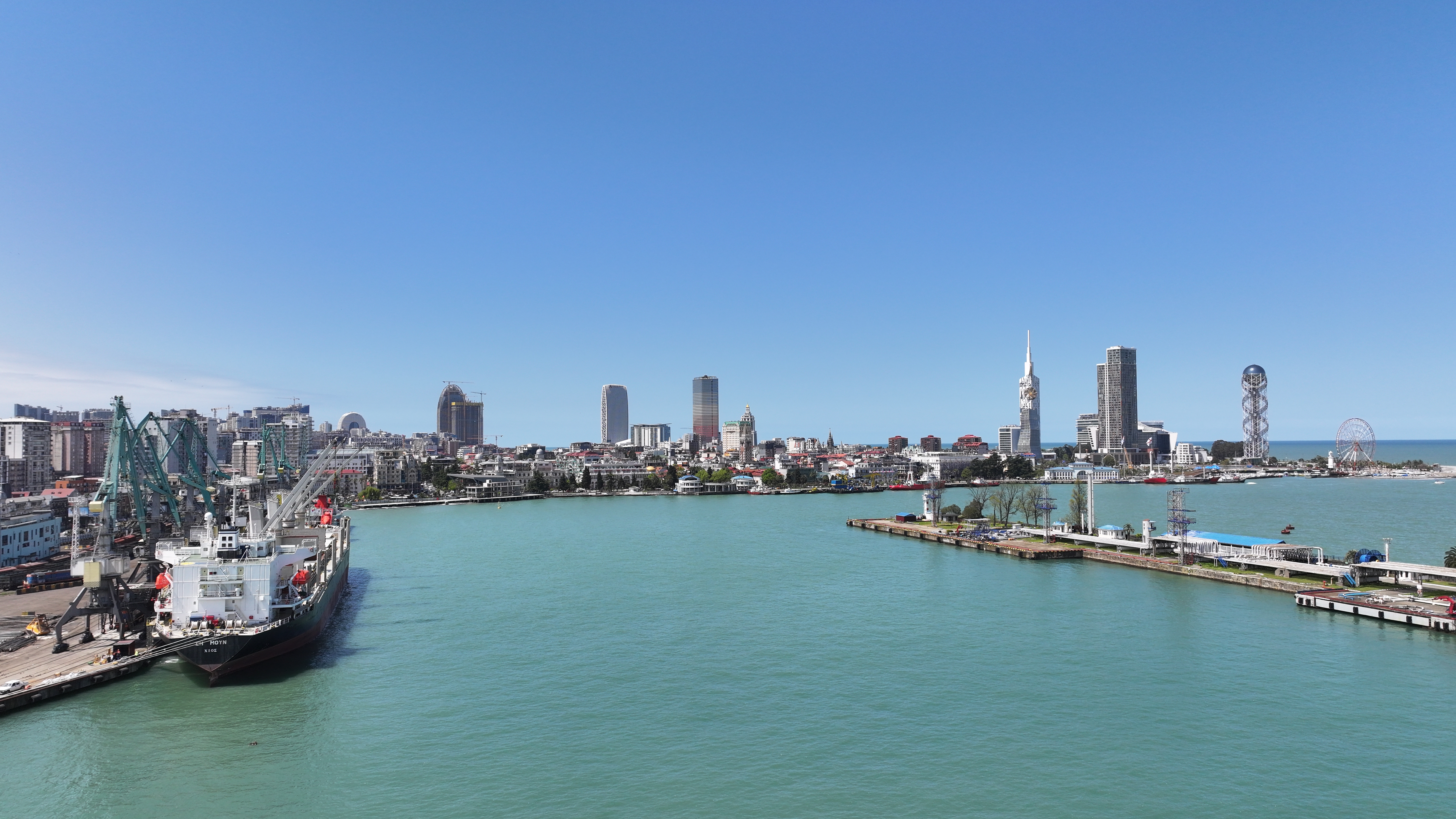 Container port with cargo ship and stacked containers